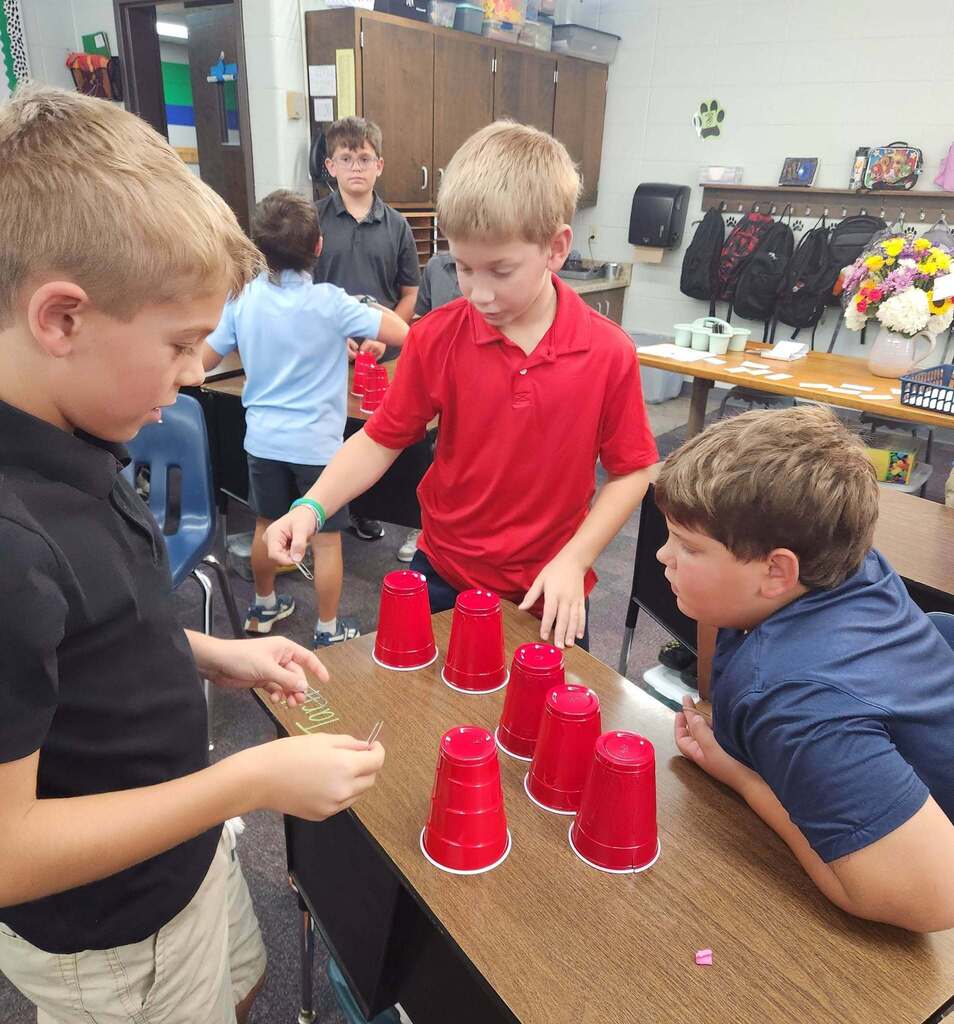 Students ontemplating where to begin this challenge.