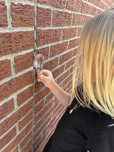 First Graders learning to use science tools.