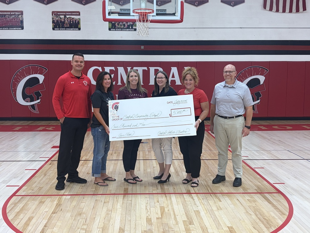 Athletic Booster presenting a check