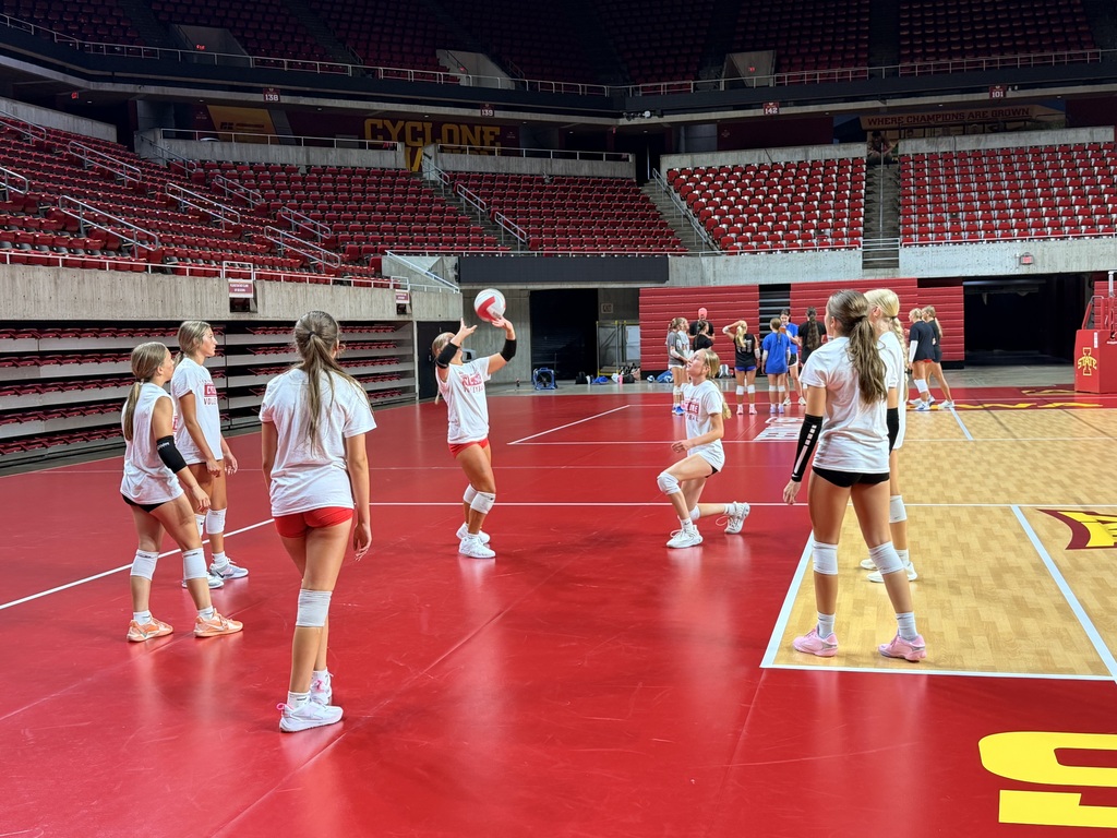 Volleyball team members warming up