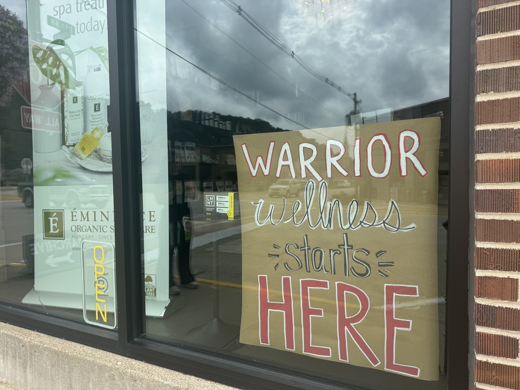 Storefront with Warrior sign in window