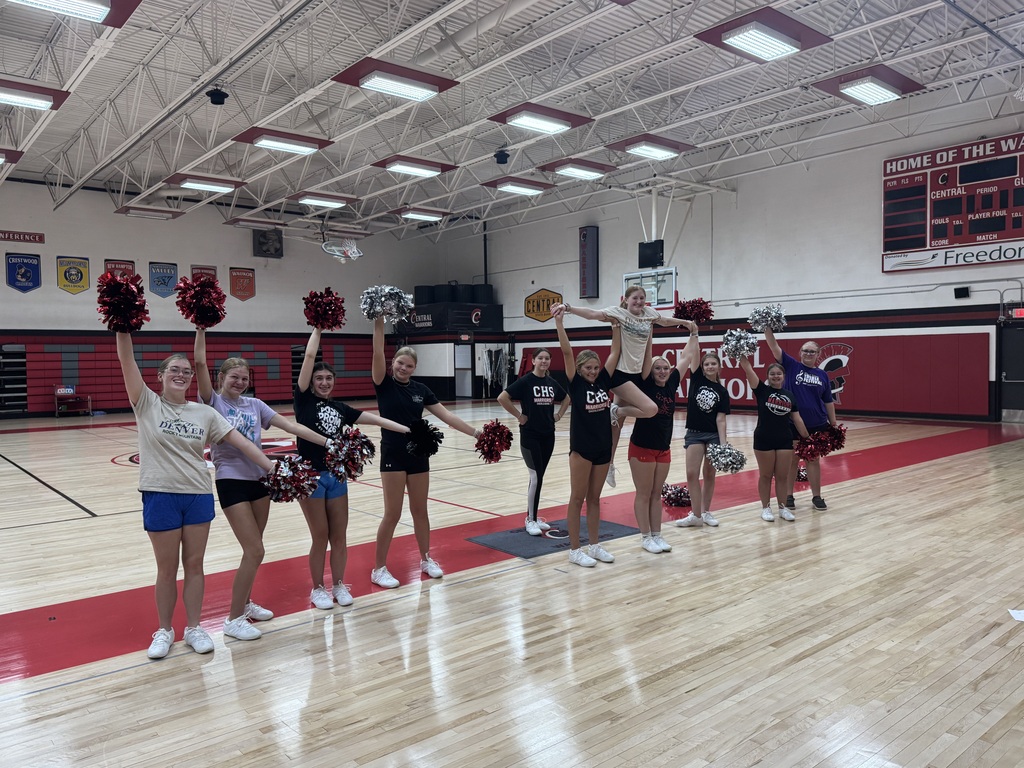 Cheerleaders practicing in the gym