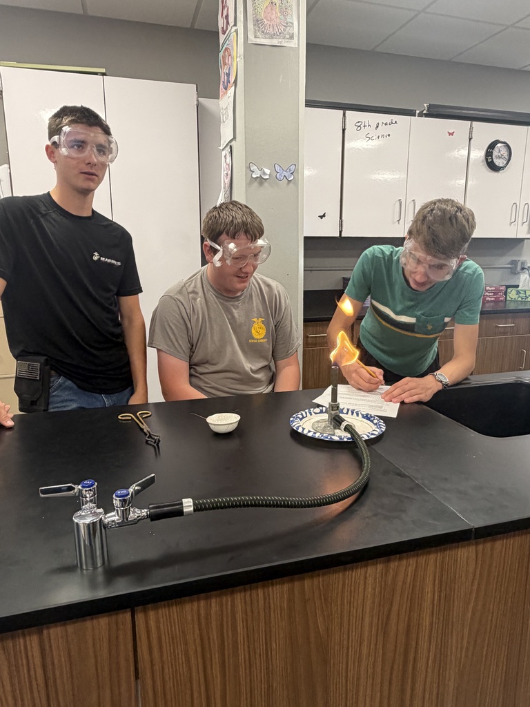 Students learning about bunsen burner safety