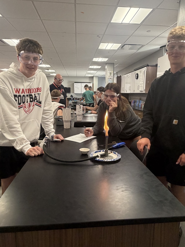 Students learning about bunsen burner safety