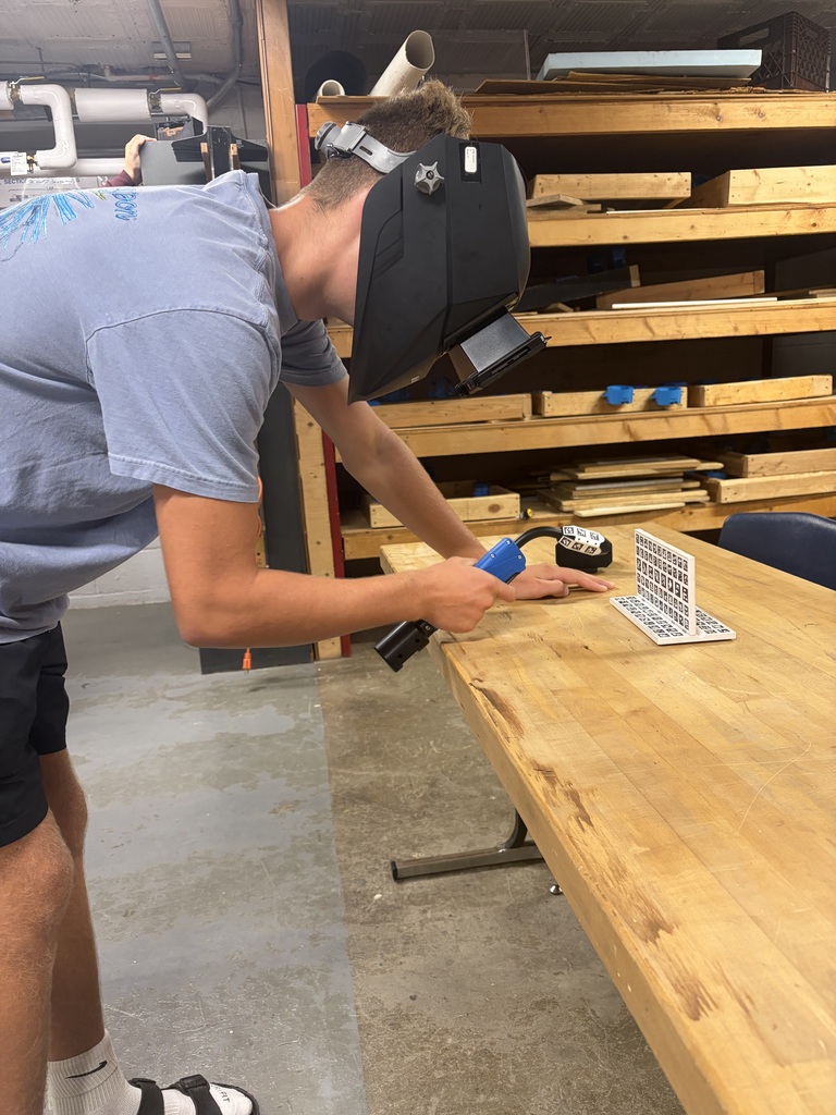 Student using welding simulator