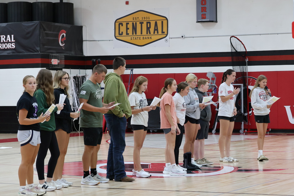 Student Council members speaking at the assembly