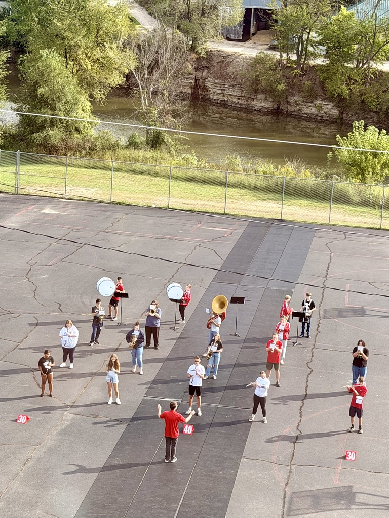 Marching band students practicing on the blacktop