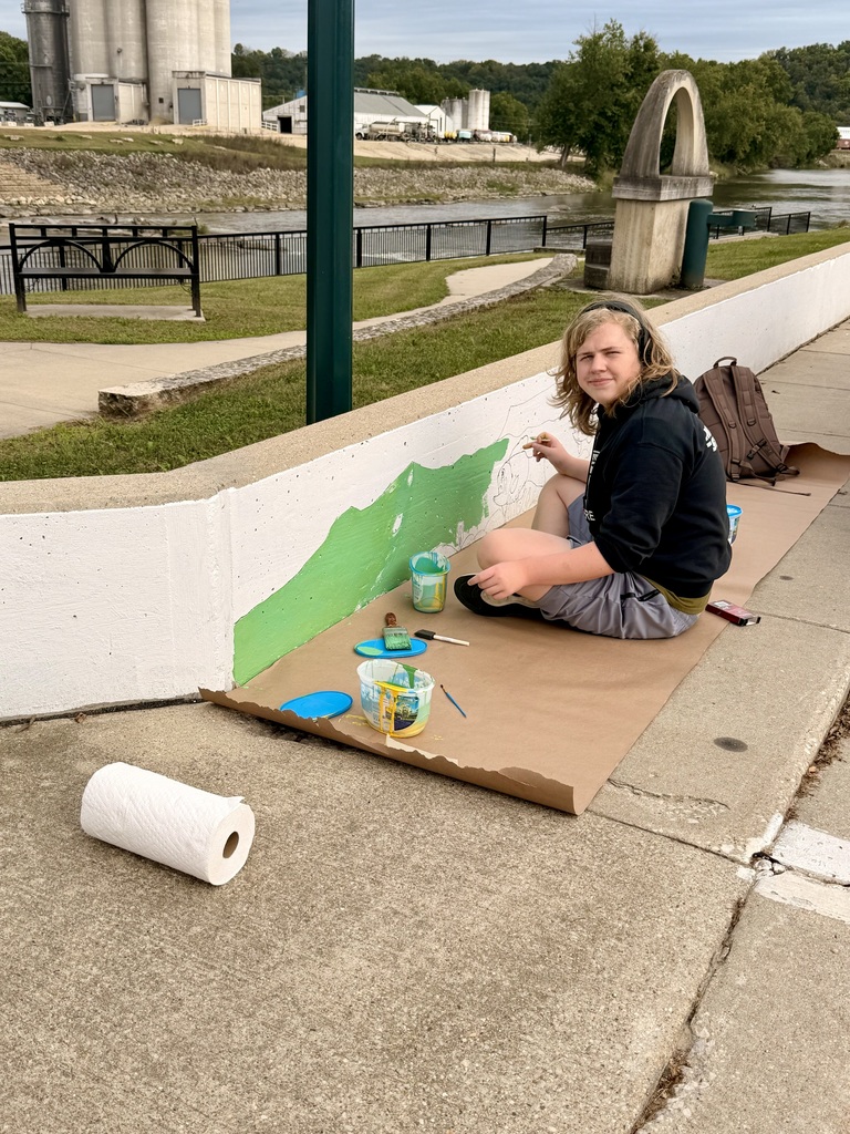 Trace Healy paining on the Riverside wall
