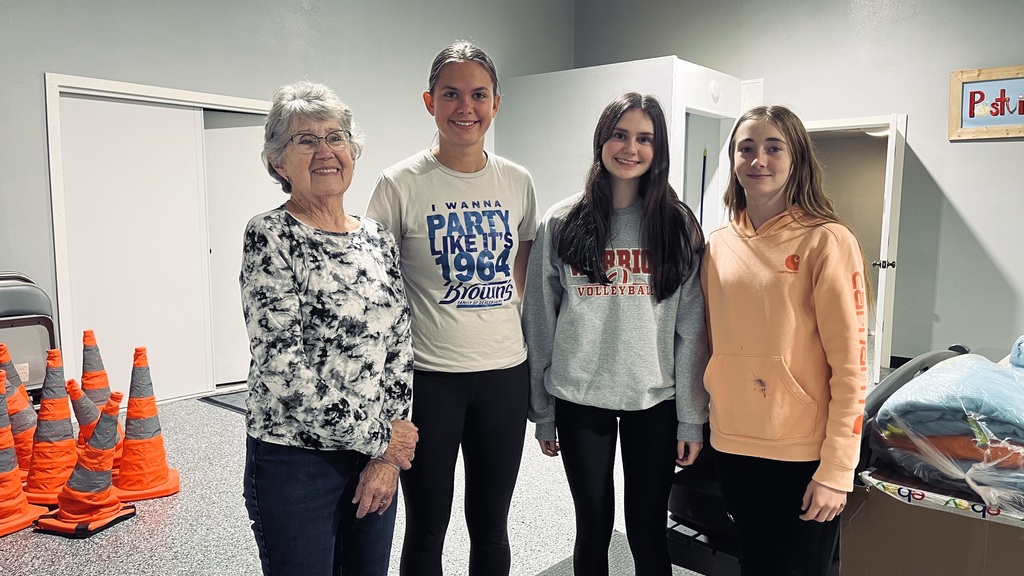 Students with the Postville Food Pantry director
