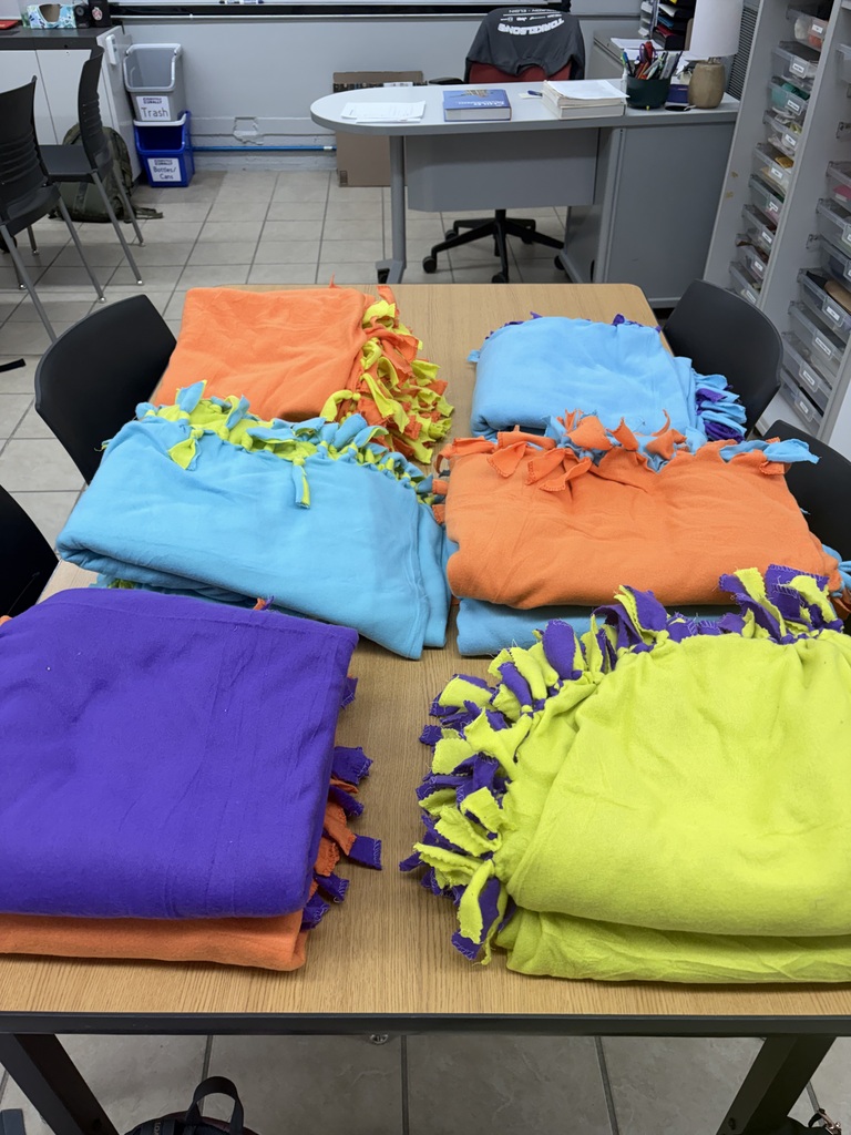tie blankets folded on a table