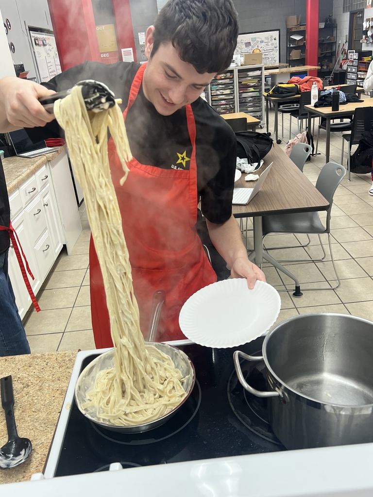 Students eating their homemade pasta
