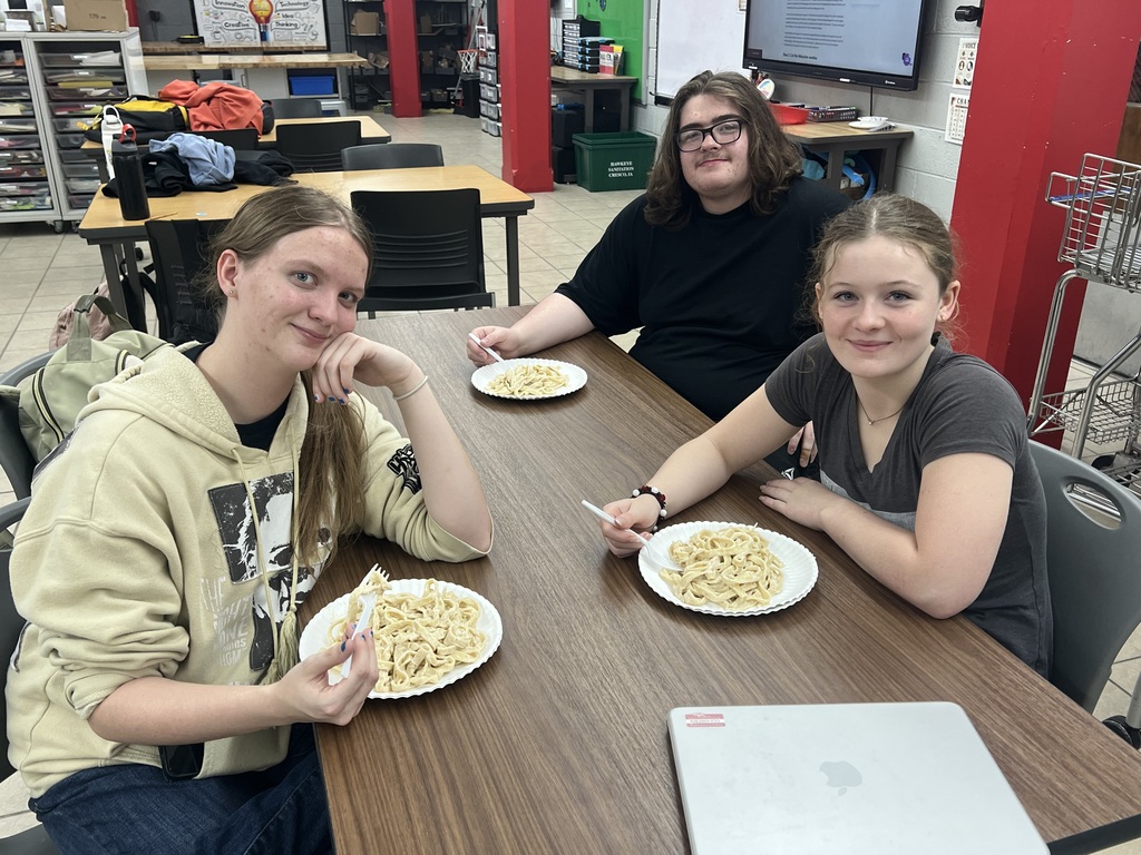 Students eating their homemade pasta