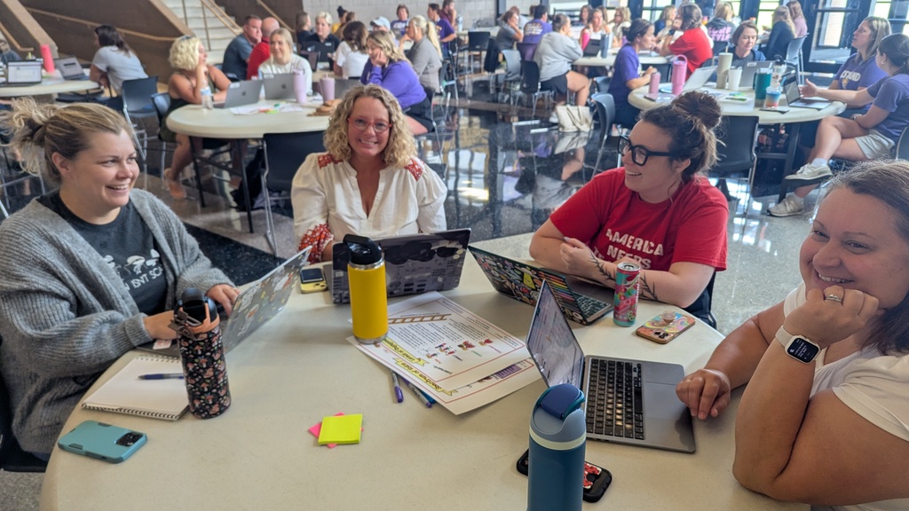 Teachers and administration collaborating at Portrait of a Saber launch