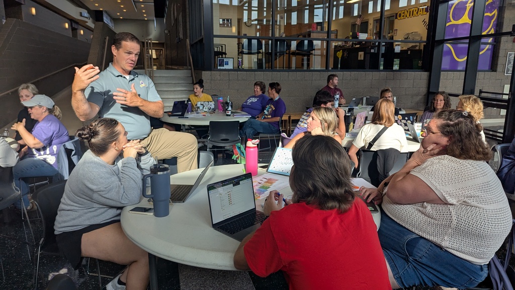 Teachers and administration collaborating at Portrait of a Saber launch