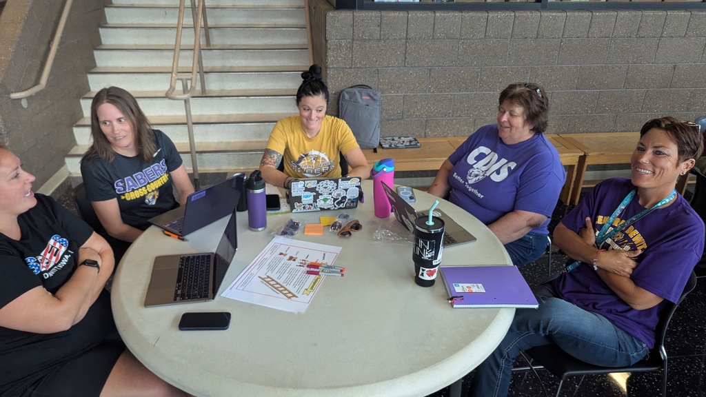 Teachers and administration collaborating at Portrait of a Saber launch