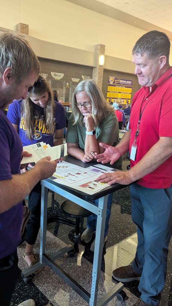 Teachers and administration collaborating at Portrait of a Saber launch