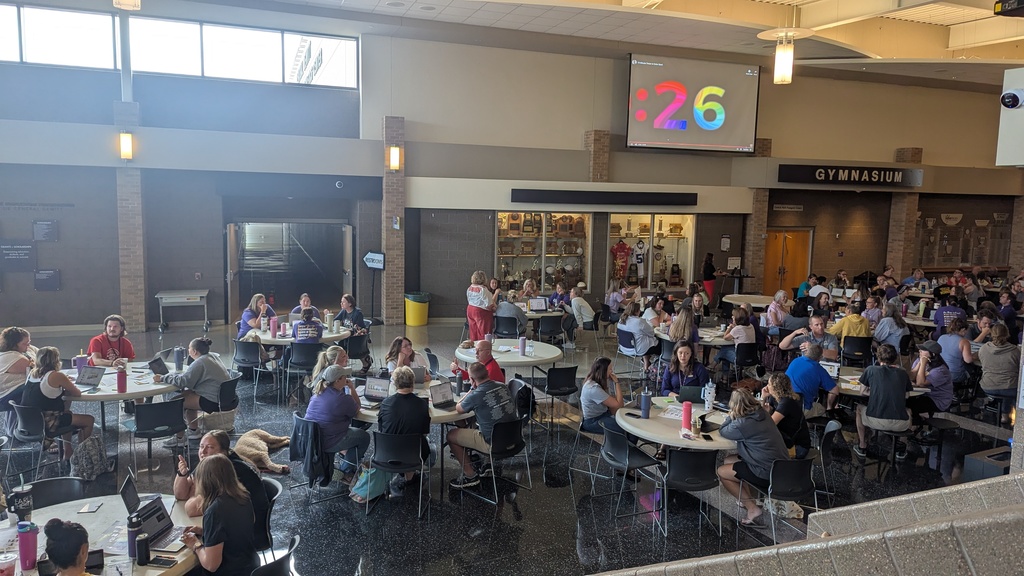 Teachers and administration collaborating at Portrait of a Saber launch