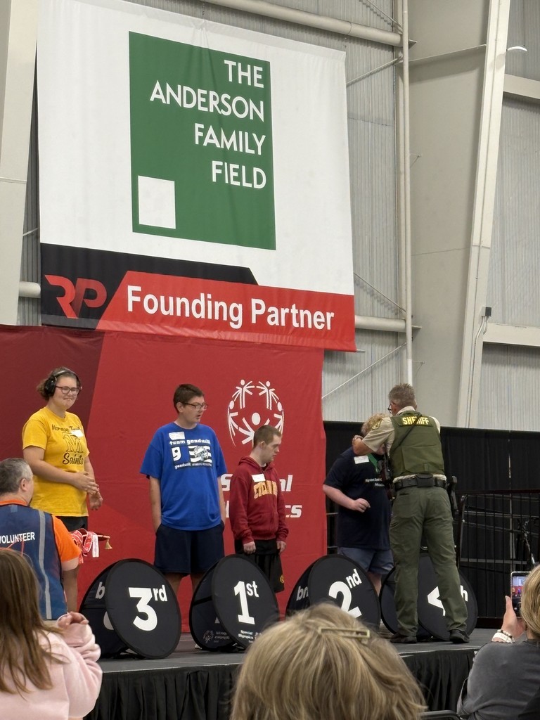 Adam Harney receiving his silver medal for pickleball skills
