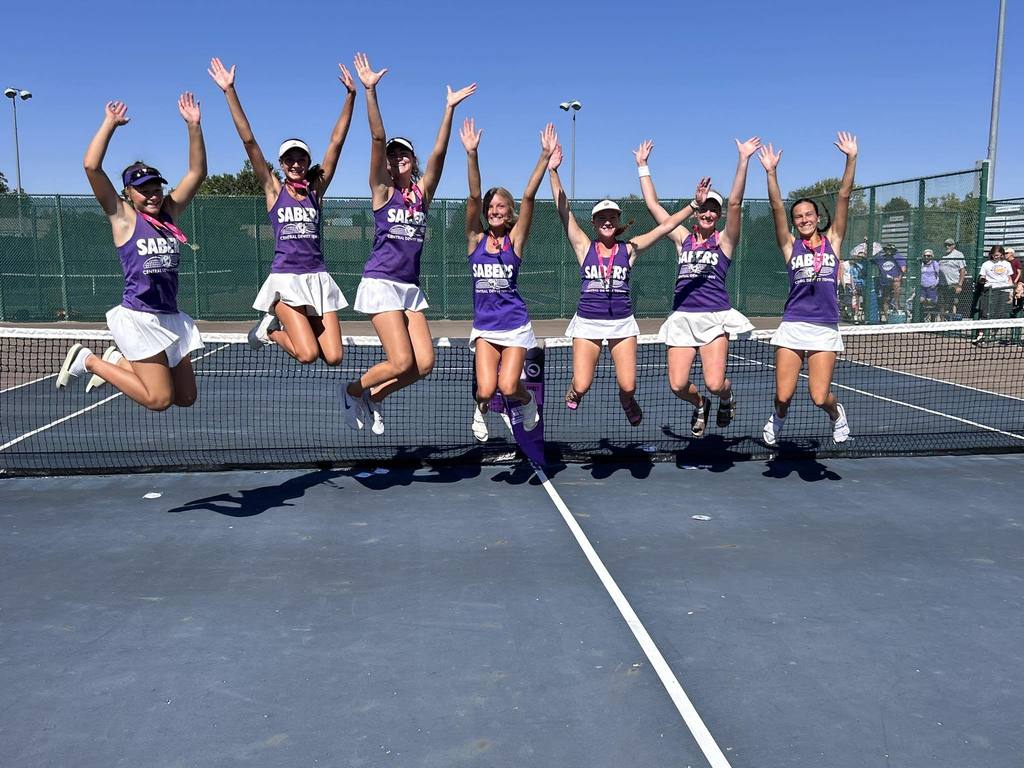 Saber Girls Tennis team jumping in the air celebrating a trip to State