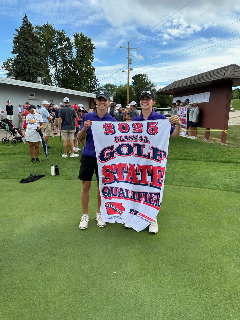 Max Froeschle and Lawson Perrone holding the state qualifying banner