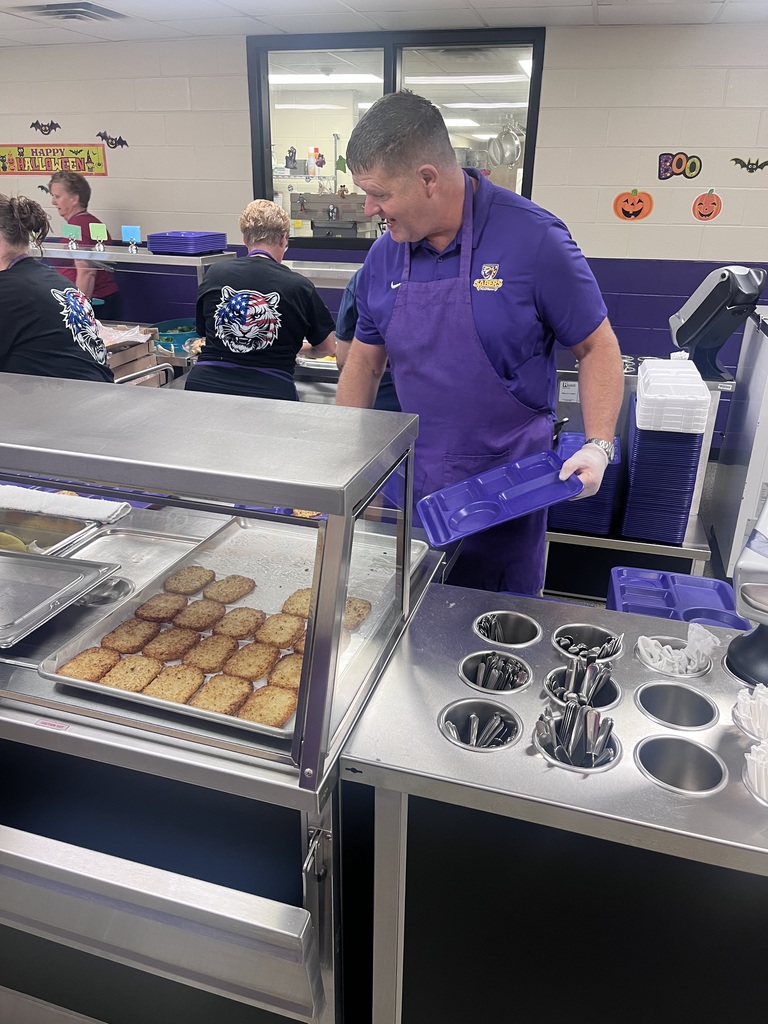 Mr. Bloom serving lunch at the high school
