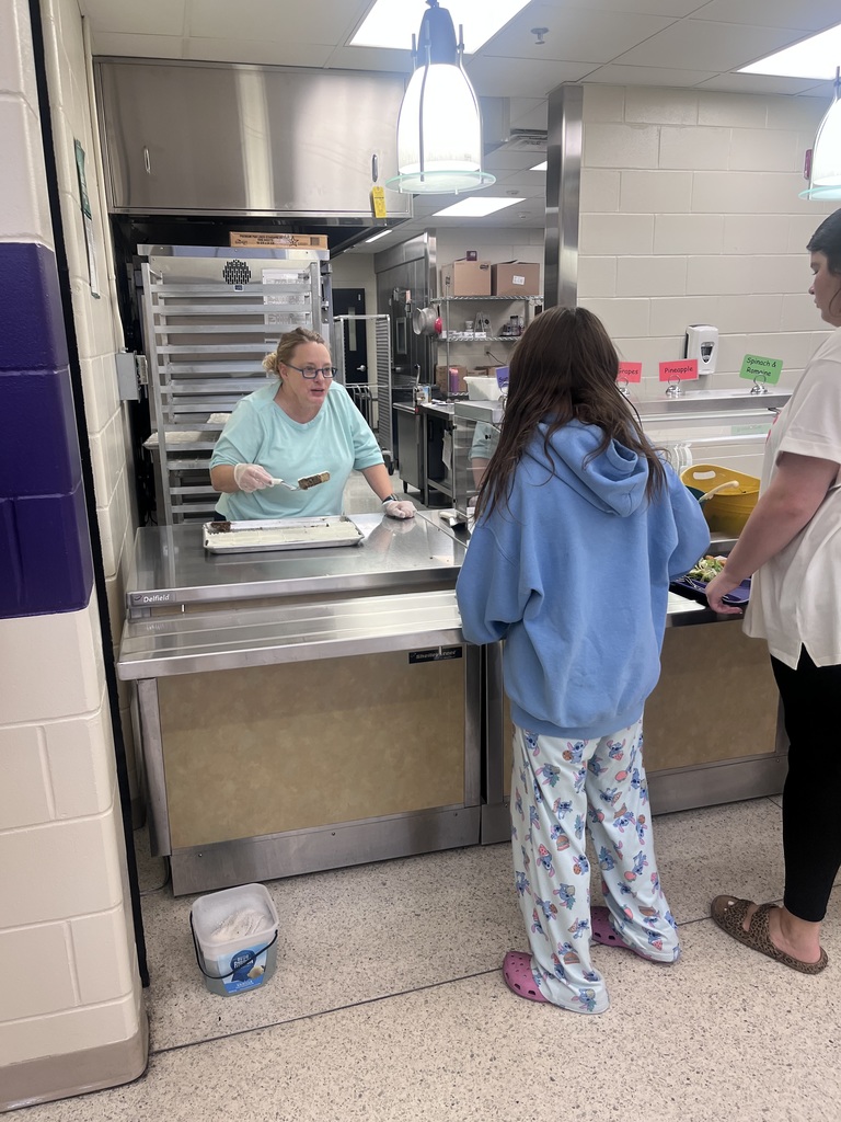 Dr. Hayes serving lunch at the middle school