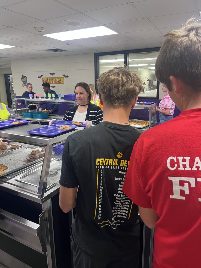 Dr. Mishler serving lunch at the high school