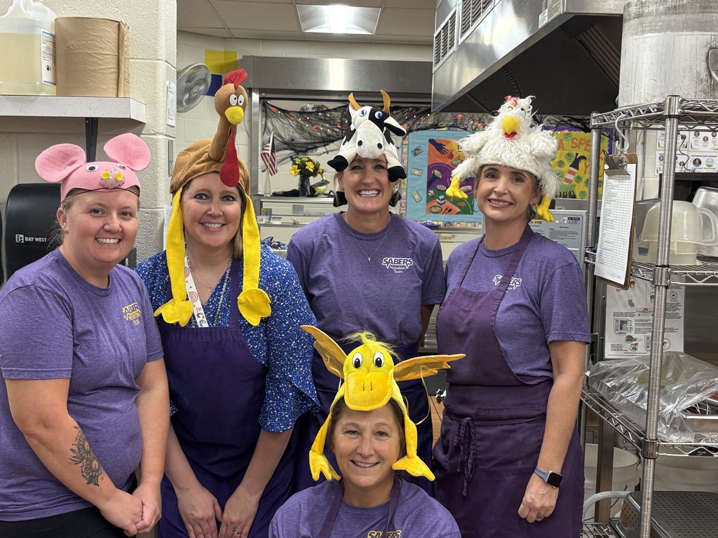 Principal Jacobsen and the CDIS Nutrition Services team wearing their "favorite food"