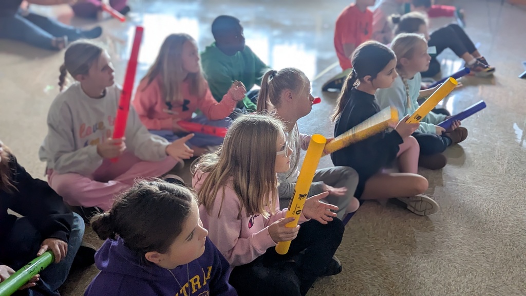 Students in Peer Stem class using Boomwhackers to learn about rhythm and how to read music