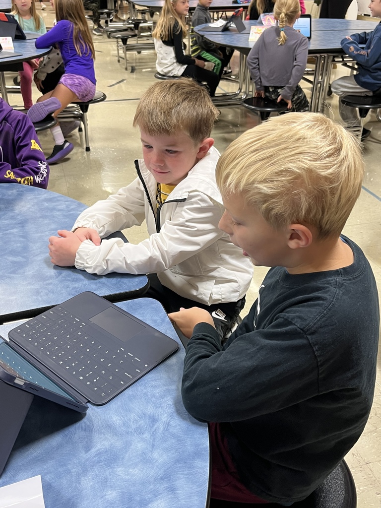 Third graders sharing their Animal Classification Research Projects  with first graders