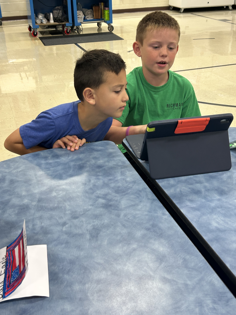 Third graders sharing their Animal Classification Research Projects  with first graders