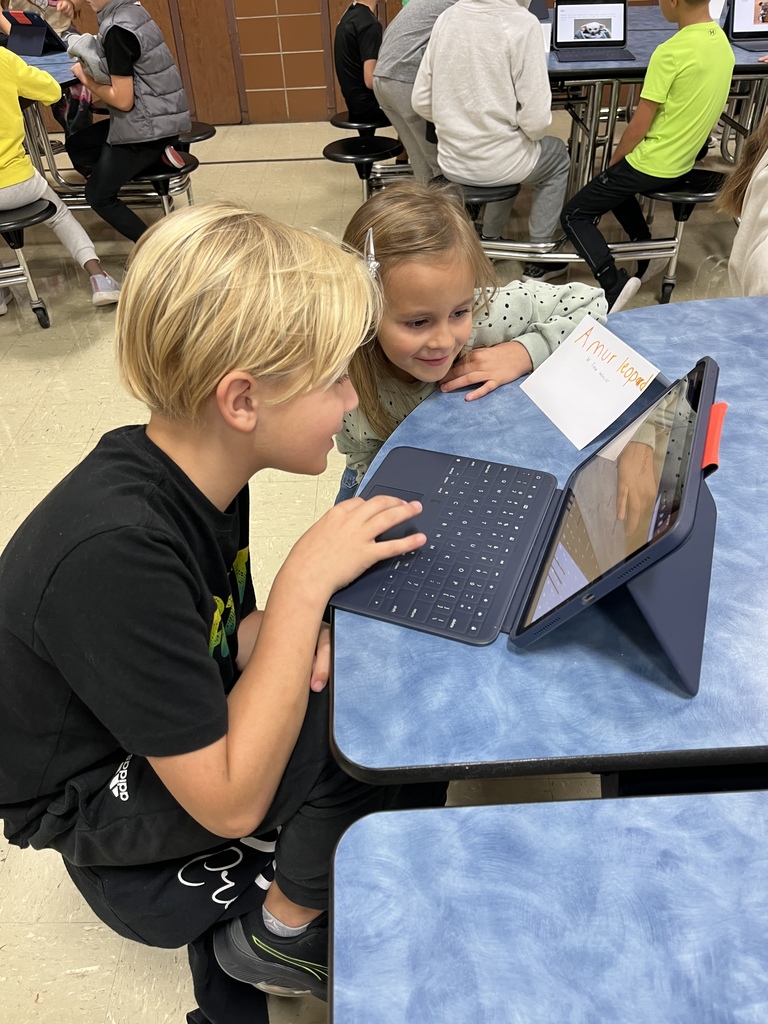 Third graders sharing their Animal Classification Research Projects  with first graders