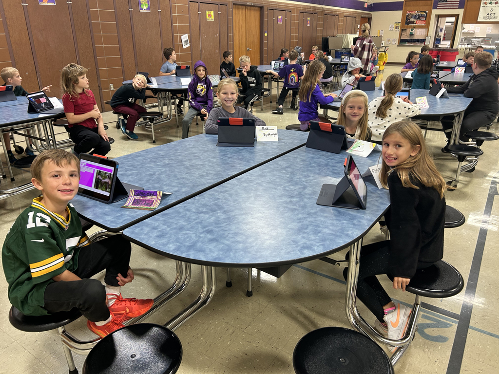 Third graders sharing their Animal Classification Research Projects  with first graders