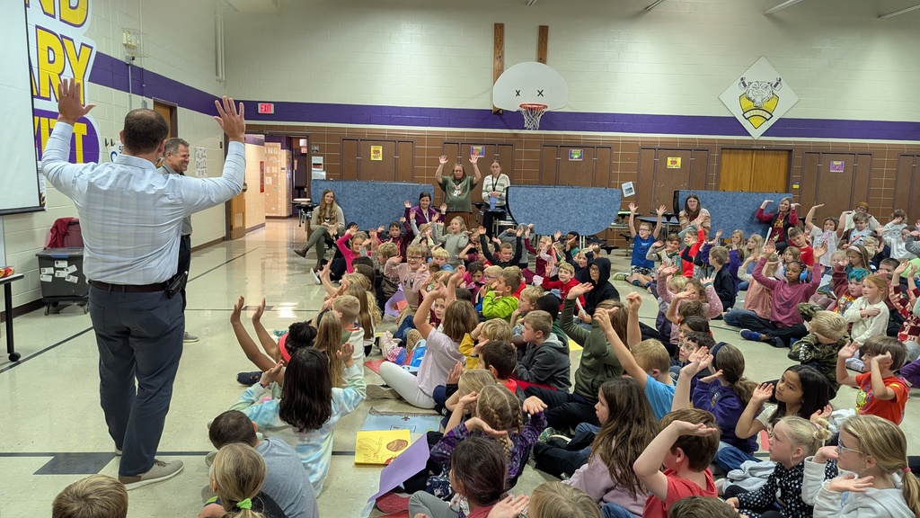 Principal Miller and students "Raising the Roof" to thank Coach Sloth for visiting