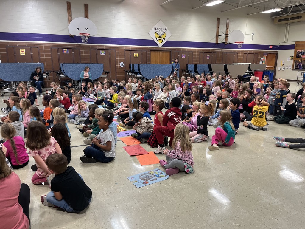 Coach Sloth wowing elementary students with his "Magic" coloring book