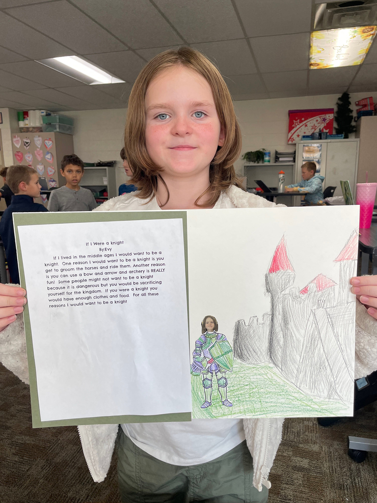 Student showing her  persuasive paragraph about which medieval role she would choose. She chose a knight.