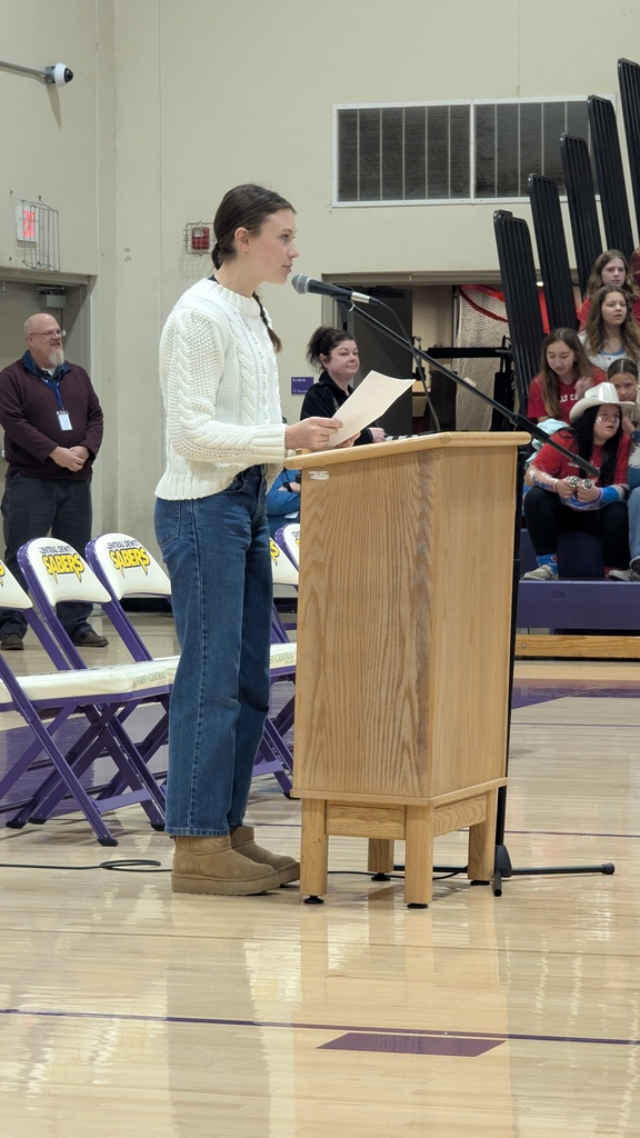 Emily Sutton welcoming everyone to the assembly