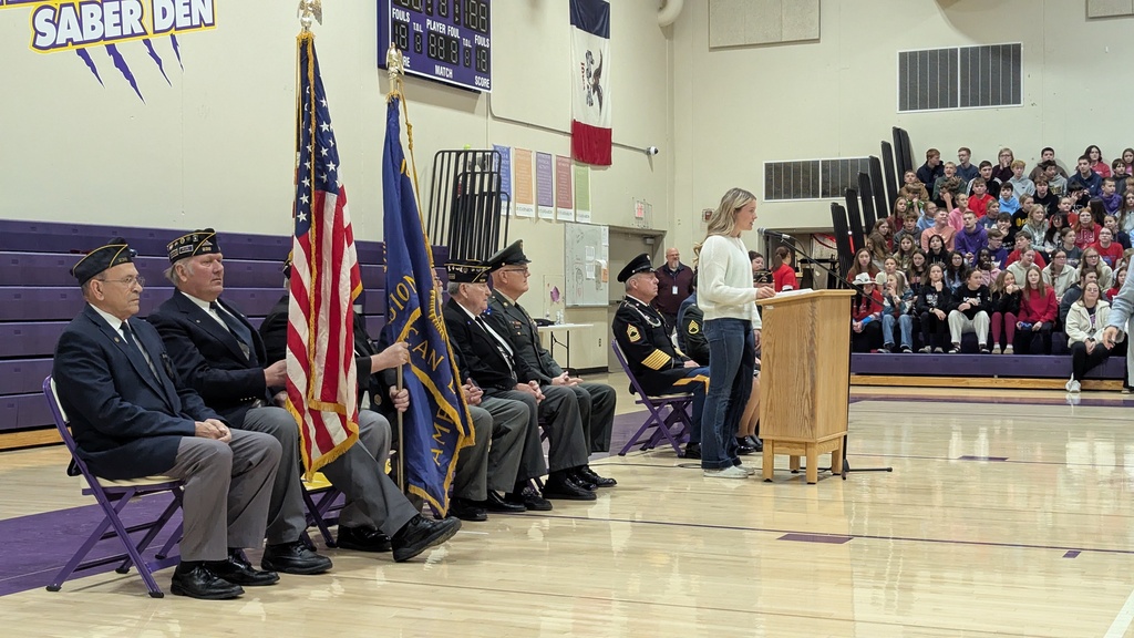 Student council member introducing the guest speaker, Michelle Willenborg