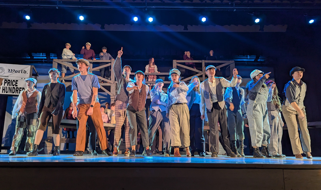 Cast performing in CDHS musical "Newsies"