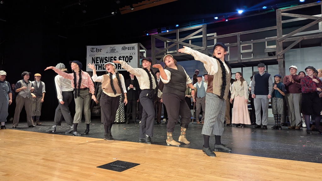 Cast performing in CDHS musical "Newsies"