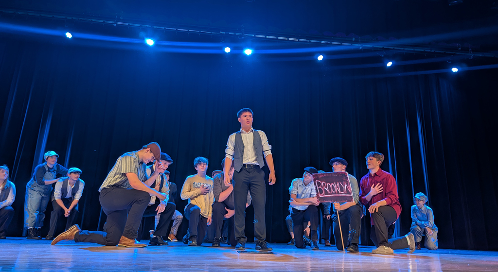 Cast performing in CDHS musical "Newsies"