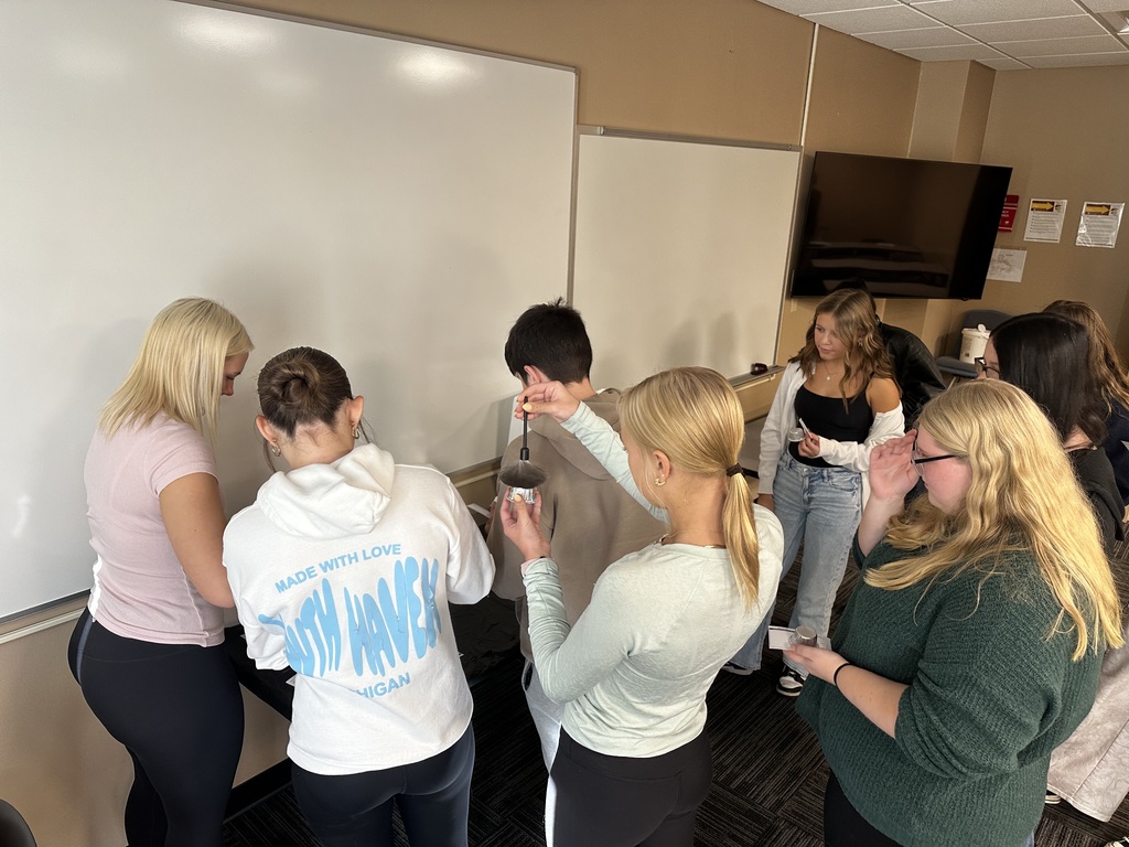 Students learning about Criminal Justice Academy and how to fingerprint people at Clinton Academy Preview Day