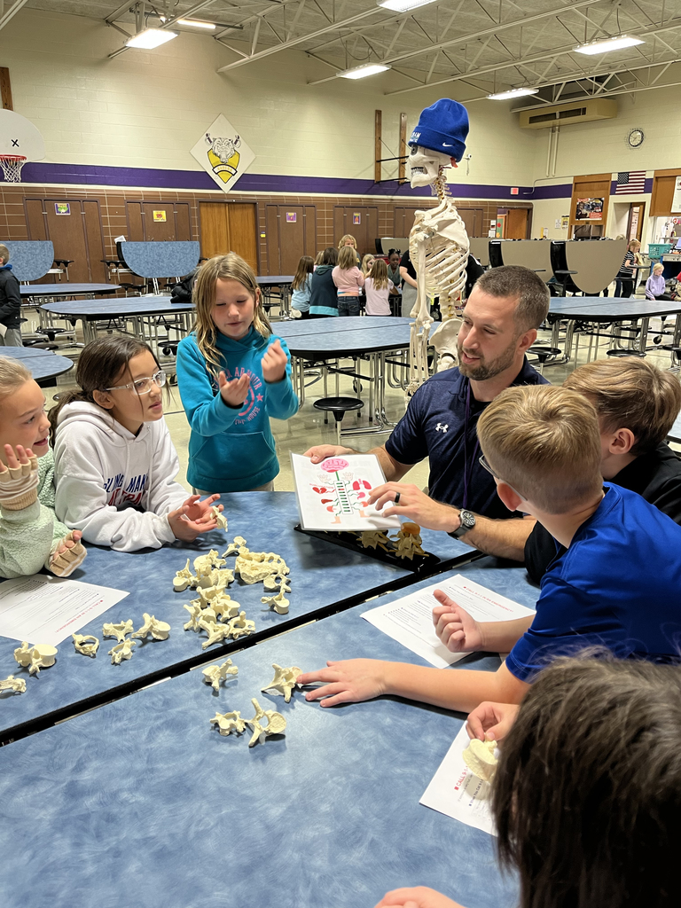 Students learning about the human body from Dr. Cram