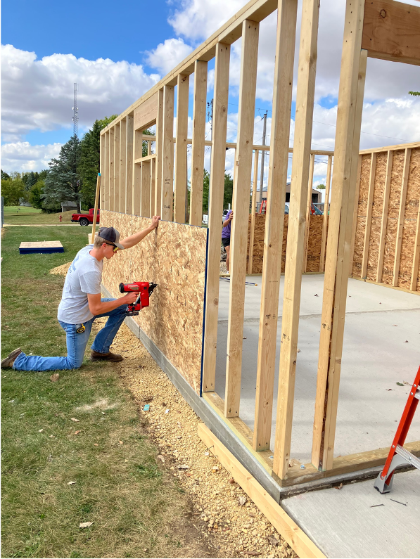 Students learning how to frame a shed