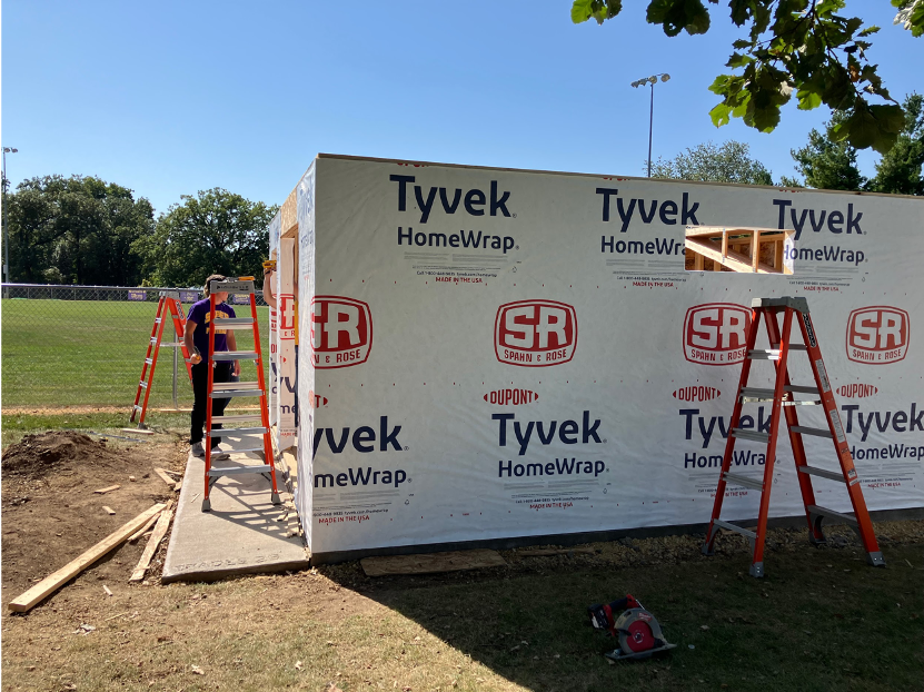 Students insulating sheds