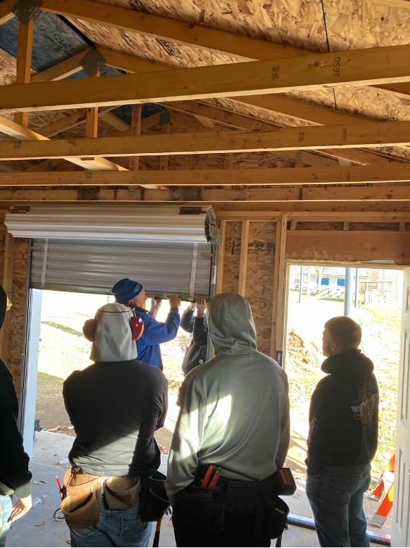 Students learn how to install doors
