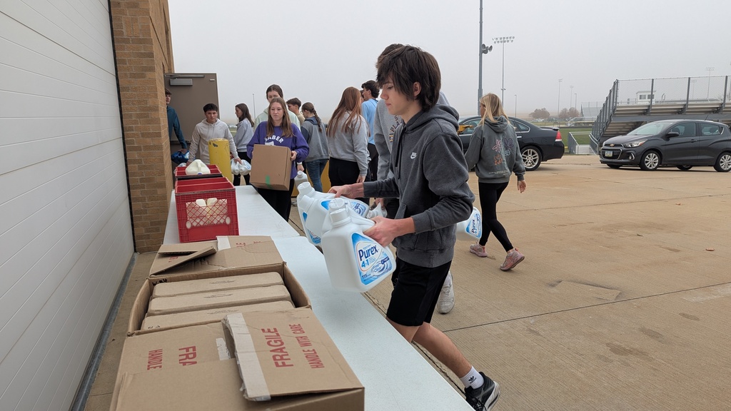 NHS students putting together Thanksgiving baskets for families in need