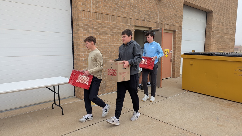 NHS students putting together Thanksgiving baskets for families in need