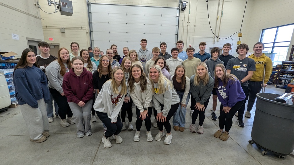 NHS students putting together Thanksgiving baskets for families in need