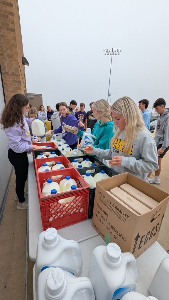 NHS students putting together Thanksgiving baskets for families in need